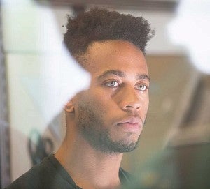 Portrait of a male student looking away from the camera Portrait of a male student looking away from the camera