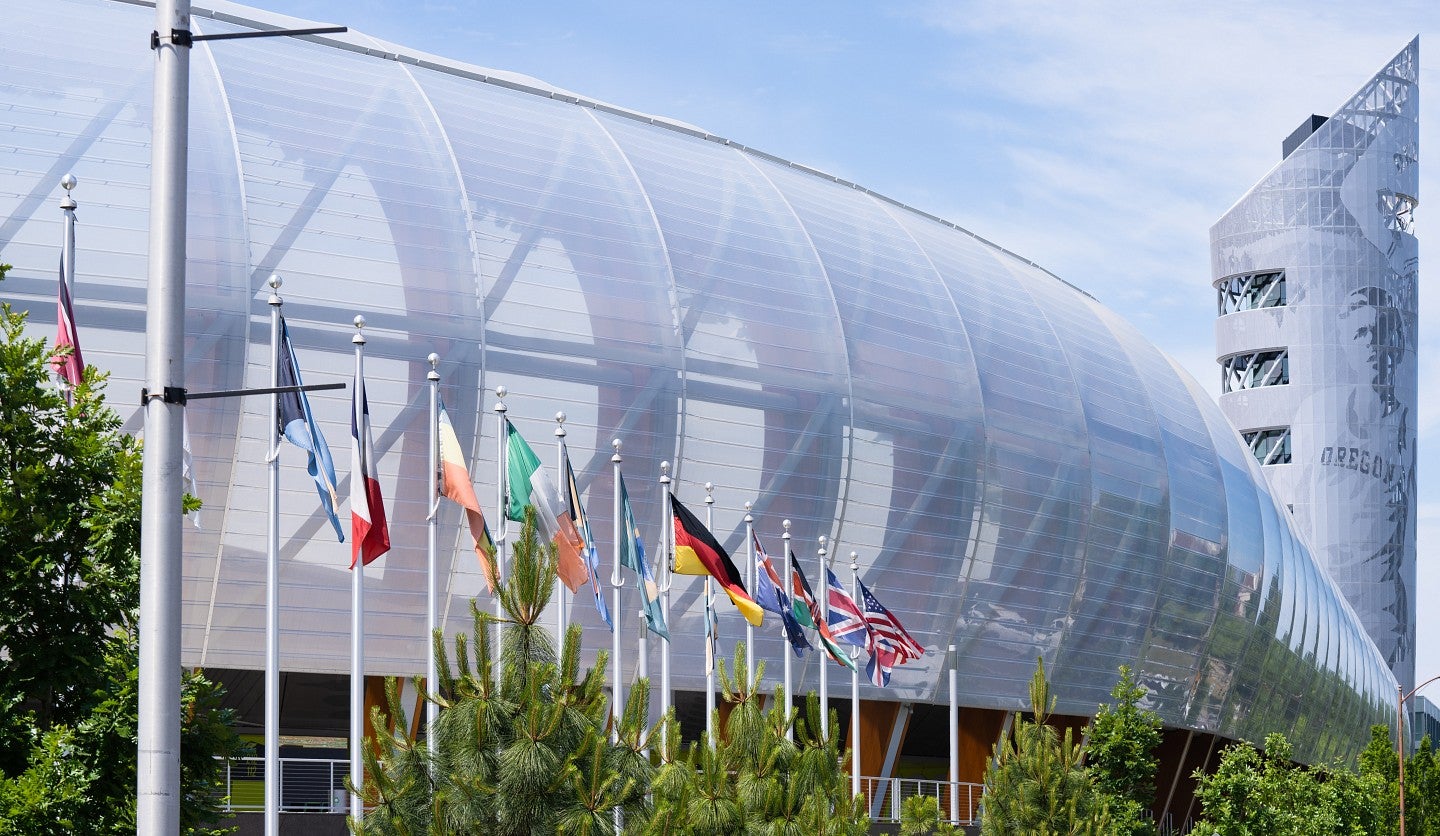 Various national flags flying outside Hayward Field.