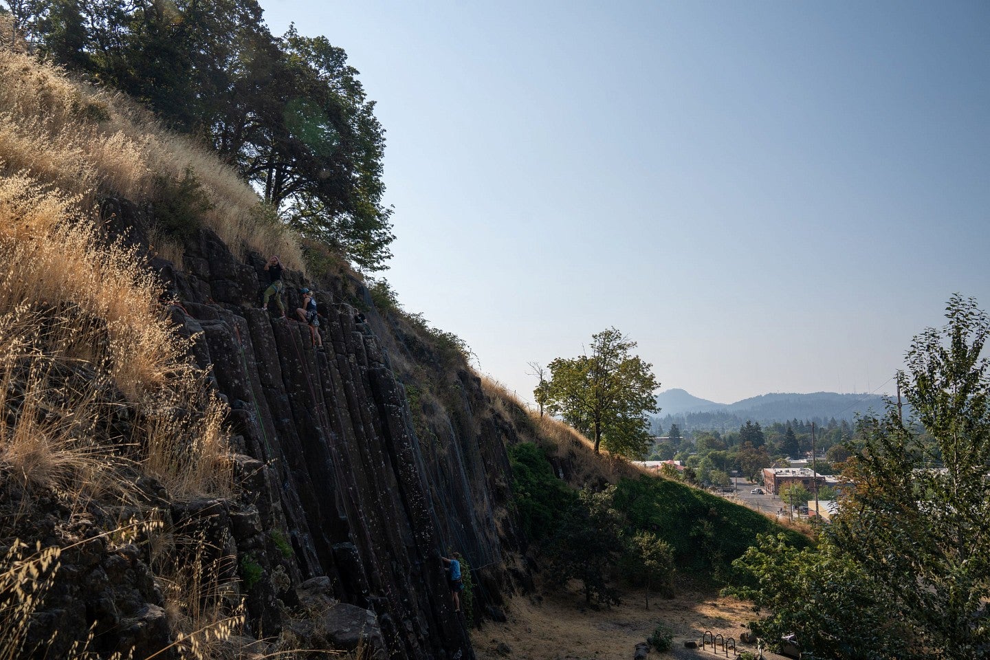 people rock climbing outside