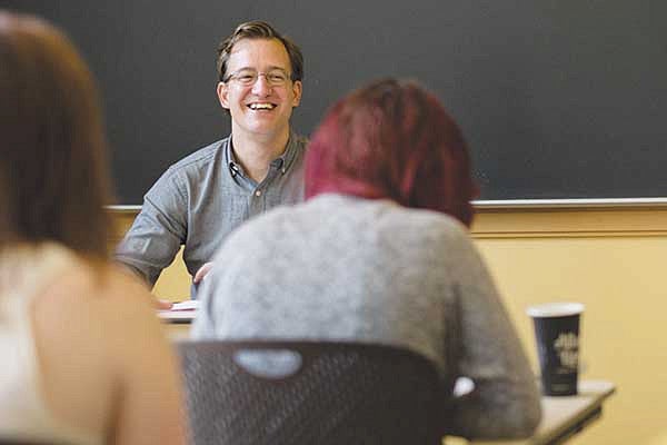 A male professor teaching a class