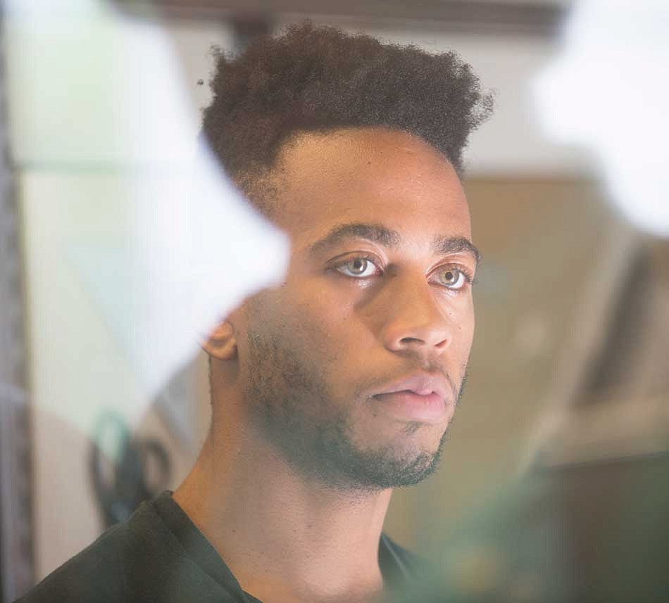 Portrait of a male student looking away from the camera