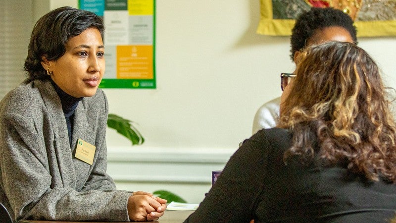 Graduate students gathering around a table