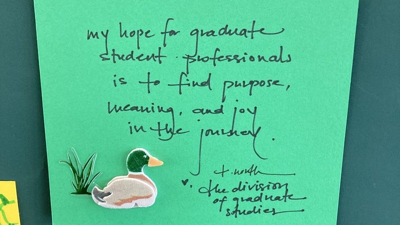 A green post it note reads: My hope for graduate student professionals is to find purpose, meaning, and joy in the journey.