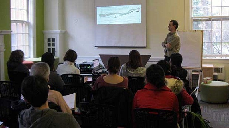 Graduate students at a presentation in the Graduate Student Center