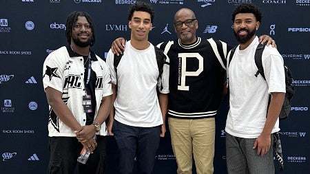 Jalen Niles, Jordan Edmond, and Toluwalase Adedipe with Dr. D'Wayne Edwards, founder of the Black Footwear Forum.