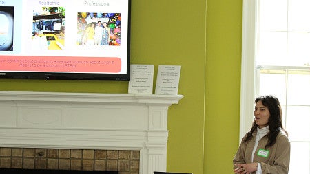 Graduate student speaking to audience 