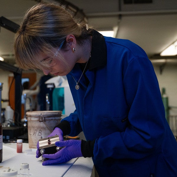 Postdoc working in lab.