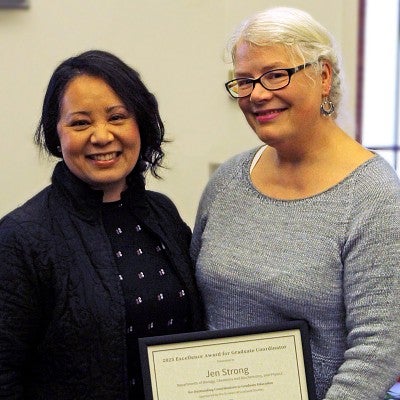 Jen Strong accepts excellence award from Vice Provost Krista Chronister