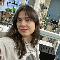 Person with dark hair in laboratory.